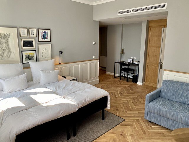 Junior suite with patterned wood floors at a Copenhagen boutique hotel