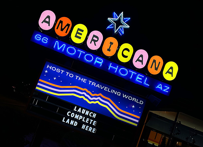 The neon sign at the Americana recalls the funky midcentury signage that decorated Route 66