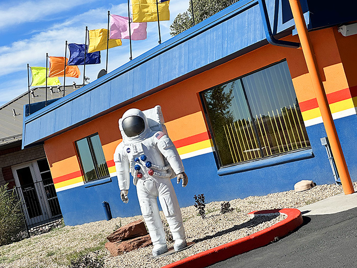 A life-size spaceman greets guests outside the lobby of the Americana