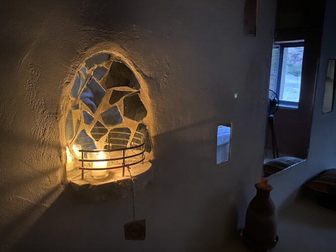 Guest room in the candlelight, Feynan Ecolodge, Jordan