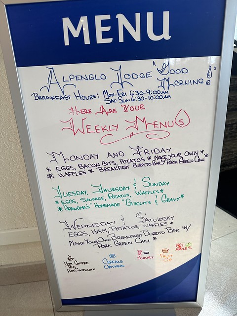 Sandwich board, featuring weekly breakfast offerings, at Alpenglo Lodge. 