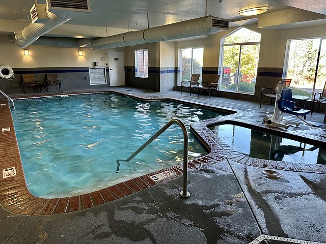 Hotel indoor swimming pool with separate hot tub. 