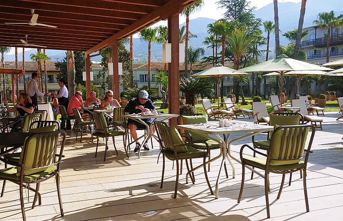 outdoor restaurant by the pool at the Kalamata Grecotel