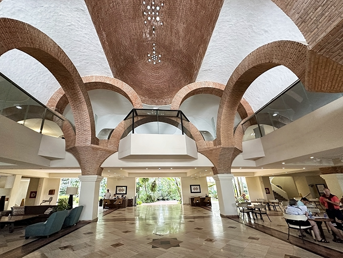 Stone archways and vaulted ceilings define the resort's spacious lobby