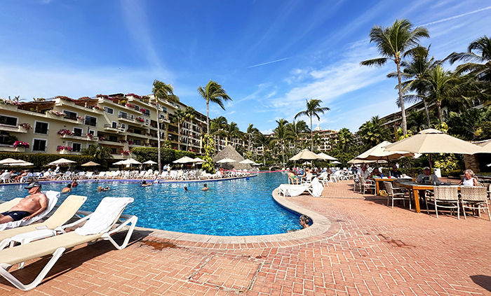 The resort rooms surround the pools and gardens