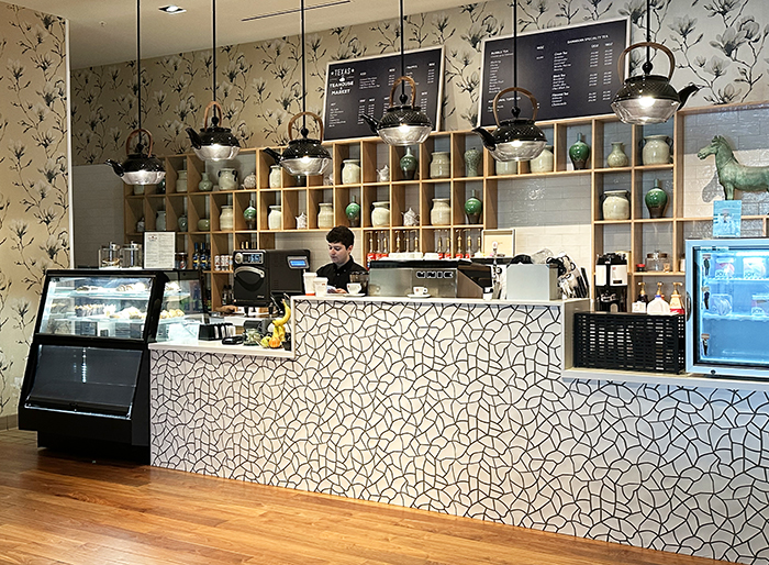 Server behind counter at Texas Teahouse in Renaissance Dallas Plano