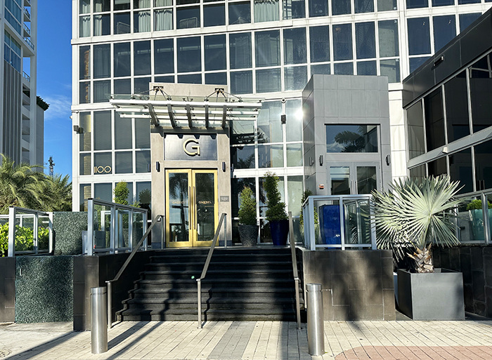 A small staircase leads to the front entrance of the Gabriel Miami