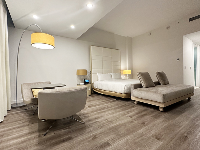 A guest room at the Gabriel Miami features minimalist furnishings and a taupe color palette.