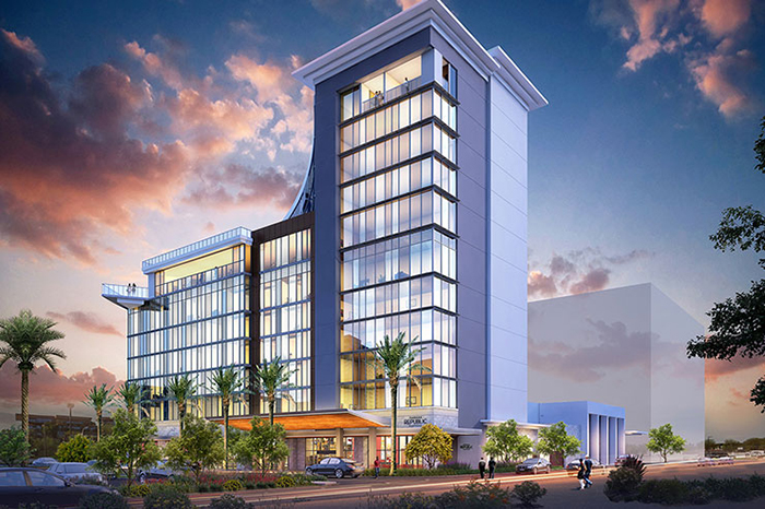 Rendering of Caesars Republic shows glass exterior with palm trees and dramatic sky