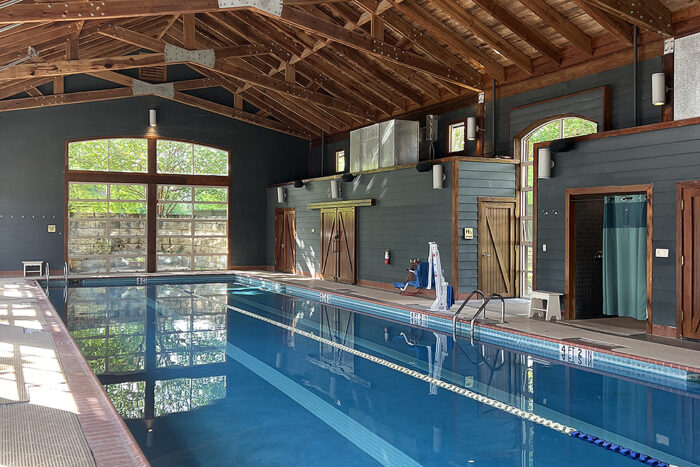 Long pool with a lap lane in a barn.