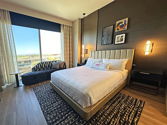 Dark neutral tones and plush bedding are a feature of a standard room at Caesars Republic.