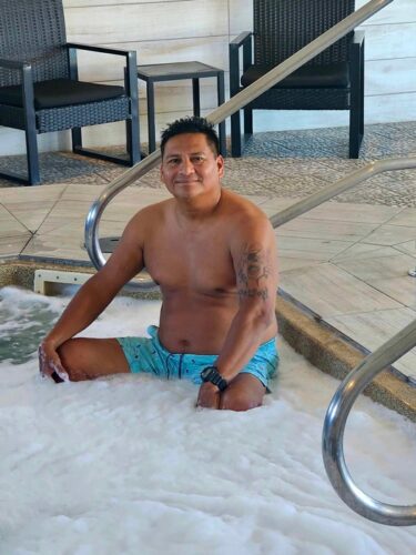 Hispanic male enjoys hot tub at Elev8 in Flagstaff, Arizona