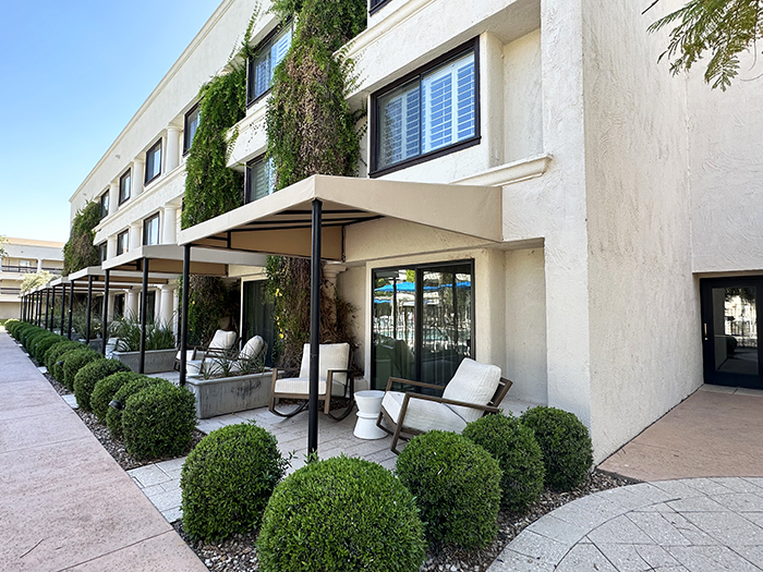 Ground floor rooms with covered patios surround the pool at The Scottsdale Resort