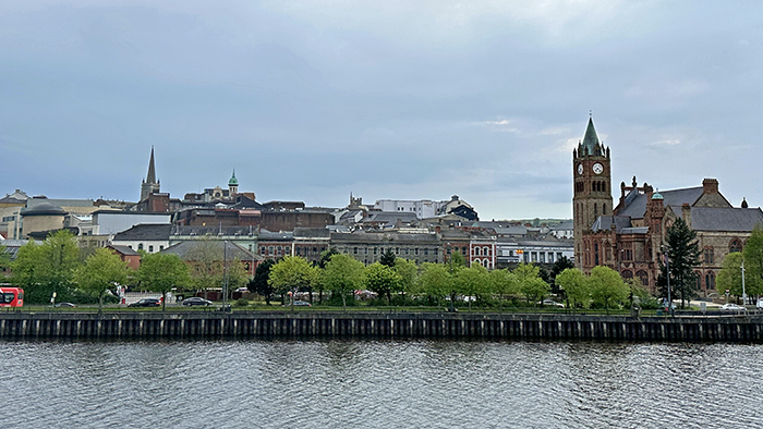 The River Foyle flows in front of the cityscape of Derry, Northern Ireland.