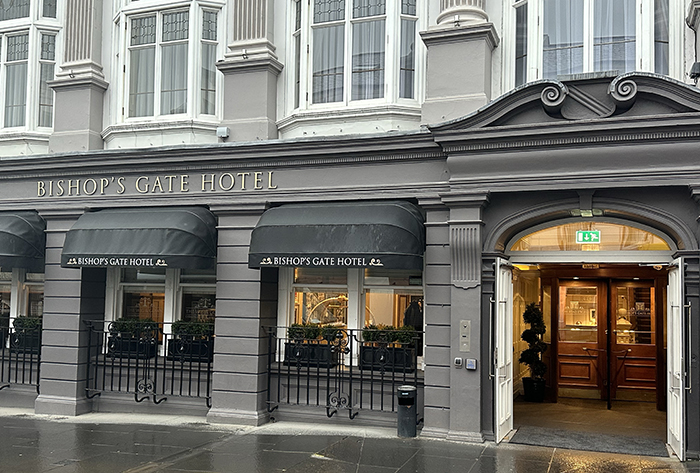 The facade of the Bishop's Gate Hotel features a rich palette of grays.