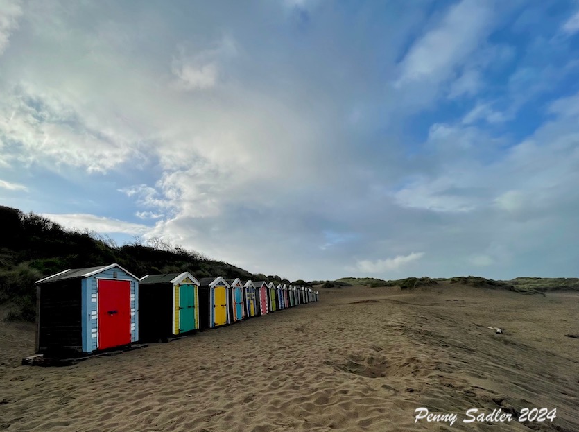 colorful cabanas on the beach at Saunton Sands