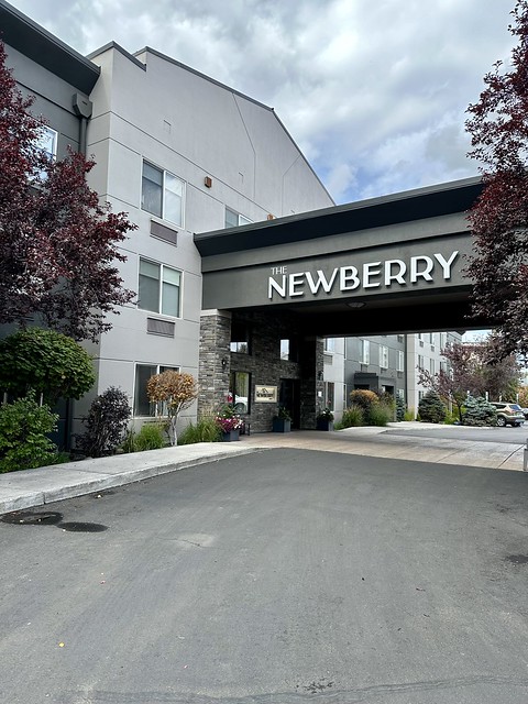 Newberry Hotel block letters on the porte-cochere of the entrance to the 3-story hotel. 