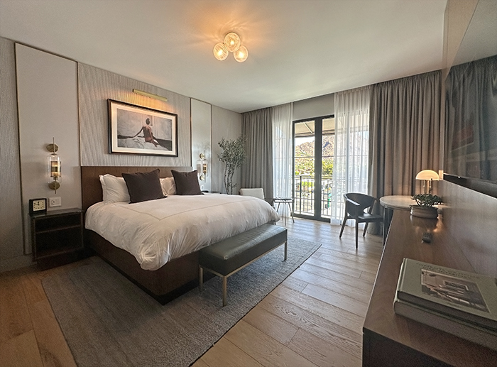 Guest bedroom features soothing palette of earth tones, beiges and whites