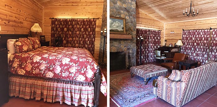 Red floral and striped textiles add bold color to a guest room's pine walls and stone fireplace